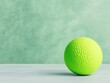© AI_Imaginator - Lime green textured ball on green background