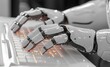 © Photo And Art Panda - robot hand on a keyboard, creating AI content for an online platform. Web banner with copy space on the right.