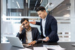 © Liubomir - A frustrated employee is scolded by his boss during a tense office meeting. The interaction highlights workplace stress and conflict, embodying a common business scenario in a corporate environment.