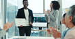 © peopleimages.com - Success, applause and man with award, boardroom and meeting for achievement, promotion and colleagues. Public relations, people and clapping for prize, accomplishment and happy for recognition