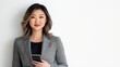 © pkproject - Confident Asian Female Business Executive Holding Smartphone