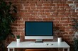 © oksa_studio - Modern loft workspace featuring desktop computer and brick wall