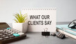 © Pawel - What our clients say. Text on tablet device on a wooden table