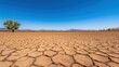 © Arfa_Media - Cracked earth and clear blue sky showing climate change
