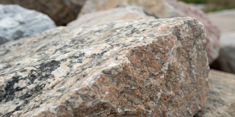 Aufkleber - A closeup view of a weathered, gray and brown rock with a textured surface, highlighting the natural patterns and details of the stone.