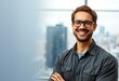 © iushakovsky - Portrait of a male engineer with a warm smile and a cityscape background