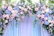 © Natalia - Elegant wedding arch adorned with pastel flowers and drapery in a serene outdoor garden setting