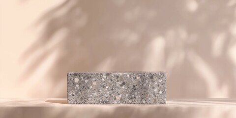 Leinwandbilder - A textured concrete block displayed on a minimalist surface with soft shadows.