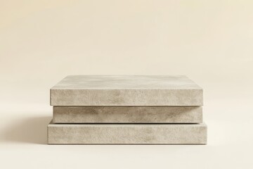 Leinwandbilder - A minimalist stack of textured concrete blocks on a soft background.