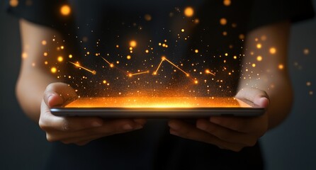 Fototapete - A person holds a tablet emitting glowing particles, symbolizing digital innovation.