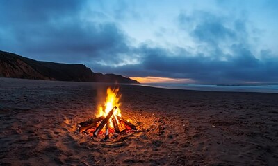 Wall Mural - A beach campfire at sunset, creating a warm atmosphere.