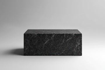 Leinwandbilder - A simple black marble block on a neutral background, showcasing minimalist design.
