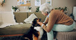 © peopleimages.com - Senior woman, retirement home and dog with affection, care and bonding for love, companion and play. Female person, pet and emotional support in living room for happiness, joy and kindness as owner