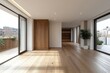 © kucret - Sunlit empty modern apartment interior with hardwood floors, large windows, and access to a balcony.