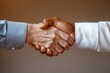 © Alexandr - close-up photo of elderly man shaking hands with young man of different ethnicity warm studio lighting