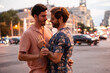 © ADDICTIVE STOCK - Romantic moment of a gay couple embracing in the city at dusk