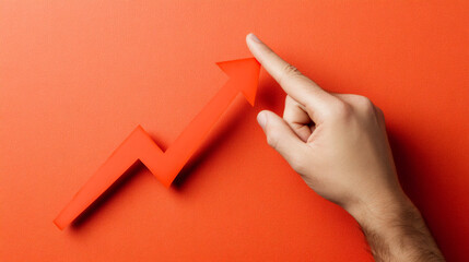 Aufkleber - Male hand is pointing at a rising red arrow symbolizing business growth, success and positive financial results