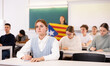 © JackF - Students study in classroom, teacher stands behind with flag of Catalonia