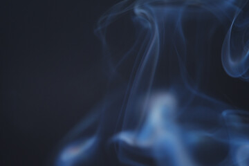 Wall Mural - close up of incense smoke as background. smoke is the gaseous products of burning materials especial