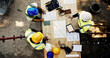 © peopleimages.com - Construction site, business people and planning with tablet for architecture, building and blueprint. Above, engineer team and employees with ideas for industry renovation, infrastructure and meeting