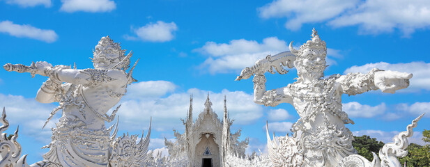 Wat Rong Khun (White Temple) main entrance in a sunny day in Chiang Rai, Thailand