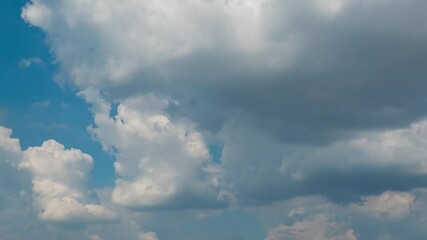 Wall Mural - blue sky with fluffy cloud time lapse on a sunny day 4k footage.
