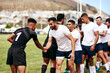© peopleimages.com - Rugby, team and handshake for greeting, introduction or sportsmanship on grass field outdoors. Sports men shaking hands and welcome for game rival, competition or training with workout and exercise