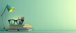 © Babycrab - Desk lamp, eyeglasses, books, and pens on a teal surface against a mint green wall.