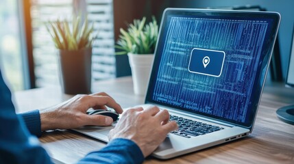 hands typing on laptop with location data and code displayed