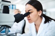 © peopleimages.com - Medical, research and women in lab, microscope and healthcare with test results. Expert, scientist or employee with professional in workplace, equipment or chemistry with breakthrough or check sample