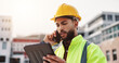 © peopleimages.com - Phone call, tablet and contractor on construction site with city development, talking or planning. Technology, industry or man with blueprint discussion for renovation approval or engineering project