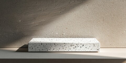 Aufkleber - A minimalist concrete object on a shelf, illuminated by soft light.