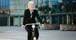 © peopleimages.com - Bicycle, happy and mature businesswoman in city with travel, journey or trip to office building. Commuting, smile and professional female executive with eco friendly transport to work in urban town.