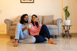 © GAJENDRRA BHATI  - Indian young happy couple drinking coffee and enjoying weekend time together while sitting in living room. harmonic relationships and happy moments concept.