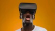 © P - A young man wearing opaque virtual reality goggles, mouth open in excitement