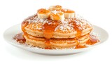Delicious pancakes topped with bananas and drizzled with syrup, isolated on white.
