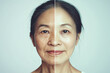 © idcreative.ddid - Photoshoot of an adult Asian woman, concept of aging before and after. Aging and youth concept, beauty treatment and lifting. Before and after. Youth, old age. Process of aging and rejuvenation
