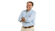 © jabireffacts - Handsome smiling businessman in blue shirt standing with arms crossed