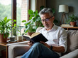 © Passion - Man is reading a book on a couch