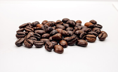 Wall Mural - Coffee beans or  Roasted coffee bean isolated on white background, Close-up