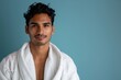 © LukaszDesign - Portrait of a man in a bathroom robe after a shower, focusing on skincare and facial hygiene in a luxurious wellness routine