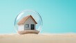 © GreatStockPics - Modern house encapsulated in a bubble on a sandy base under a clear sky