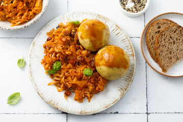 Wall Mural - Stewed cabbage with dumplings and gravy