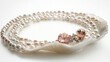 © Argan - Elegant Pearl Necklace Adorned with Seashells on a Pearl Shell Display