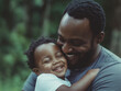 © Vasili - A heartwarming moment of a father holding his child close, both smiling lovingly. Captures familial bond, warmth, and happiness in an outdoor setting with soft focus.