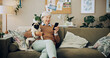 © peopleimages.com - Senior woman, home and dog with mobile phone, affection and bonding for love, companion and play. Female person, pet care and emotional support in living room for happiness, joy and kindness as owner