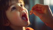 © Dalibor - A child learning to swallow a small vitamin pill with encouragement from a parent.