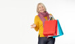 © missty - Shopper, tote bag handbag. Shopaholic shopping woman holding many shopping bags excited isolated on white.