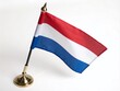 © Danicha - Miniature Flag of the Netherlands Isolated on White Background for Product Photography, Showcasing Dutch Culture and National Pride with Vivid Colors and Detailed Design
