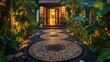 © azi - Illuminated pebble pathway leading to tropical home entrance at night.